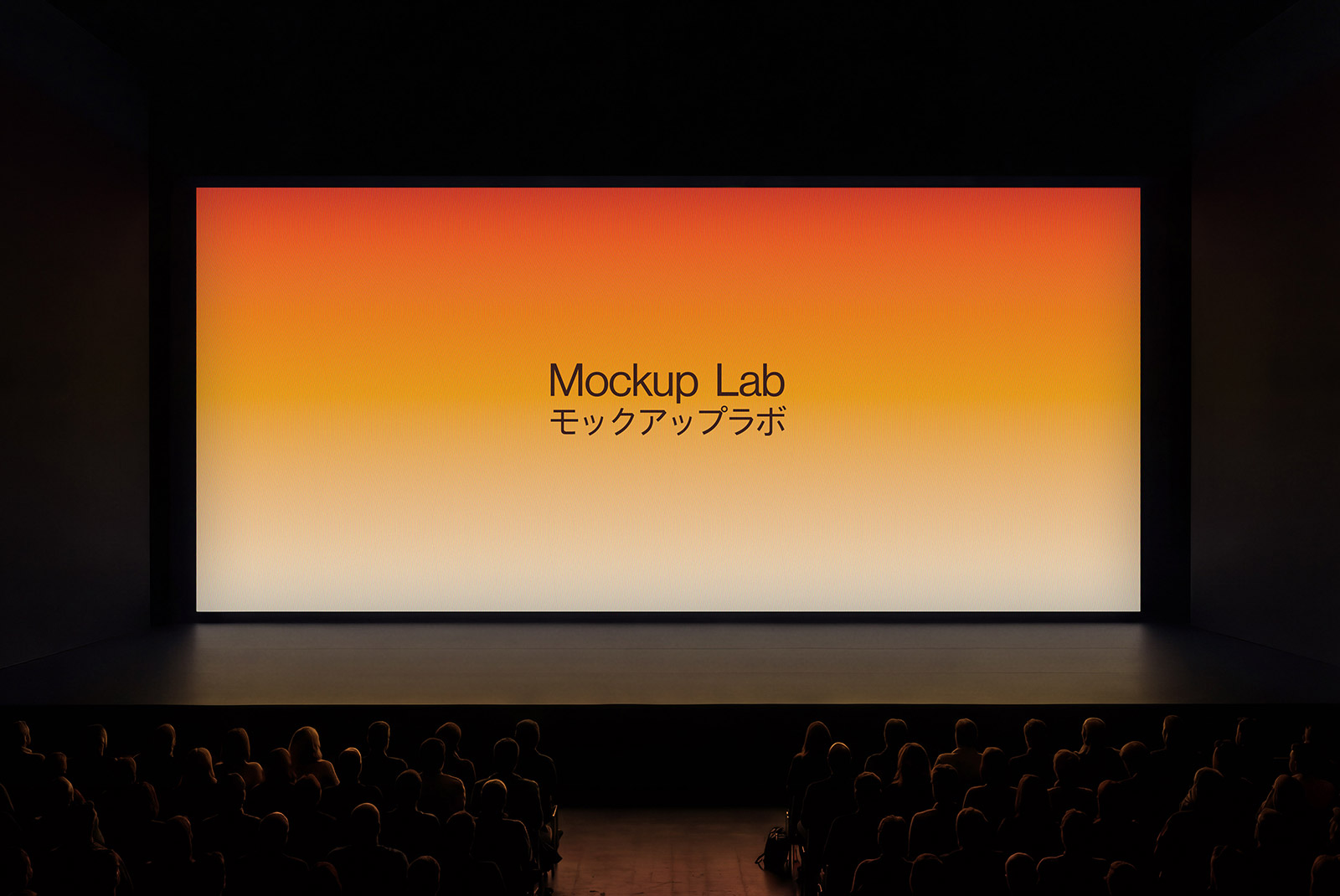 Frontal view of a large digital screen on a conference stage displaying a user interface.